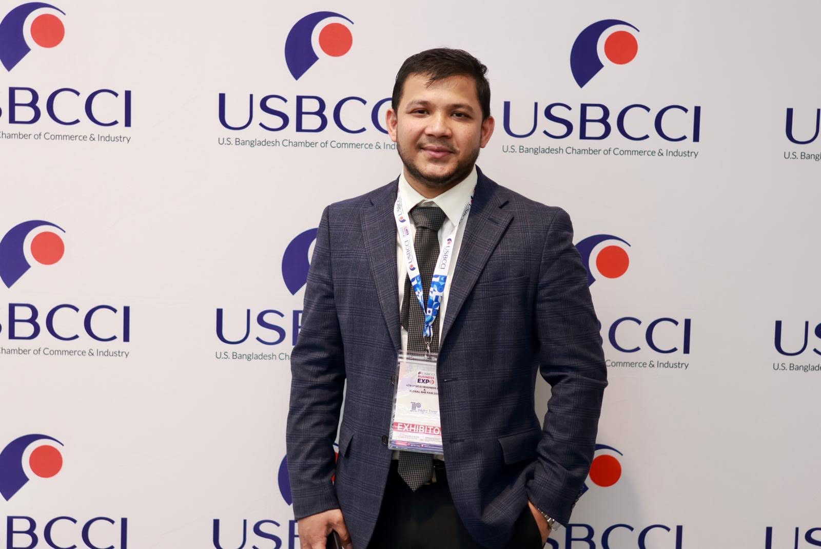 Abul Hasan Molla at the USBCCI Business Expo, wearing his exhibitor badge